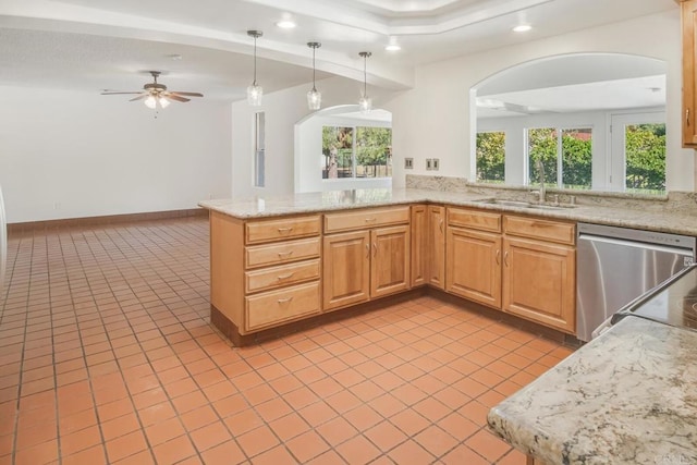 kitchen featuring pendant lighting, sink, dishwasher, light tile patterned flooring, and kitchen peninsula