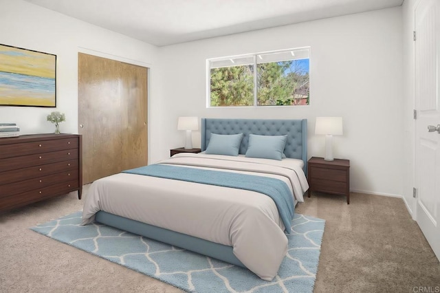 bedroom with light carpet and a closet