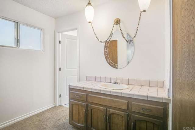 bathroom featuring vanity and a textured ceiling