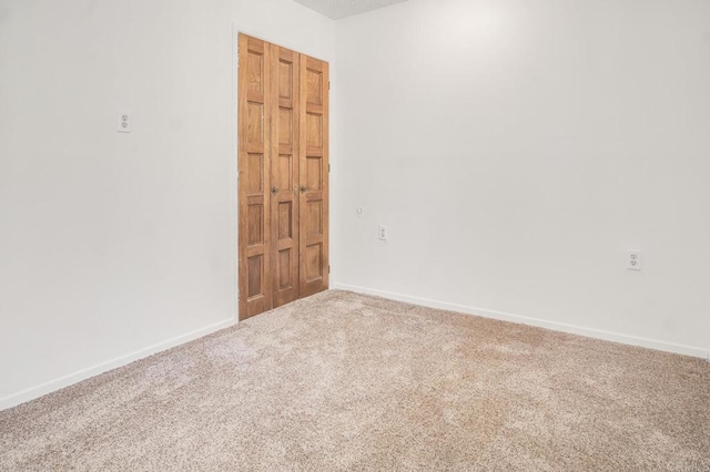 spare room featuring carpet floors