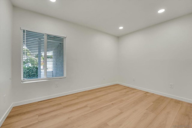 spare room with light wood-type flooring