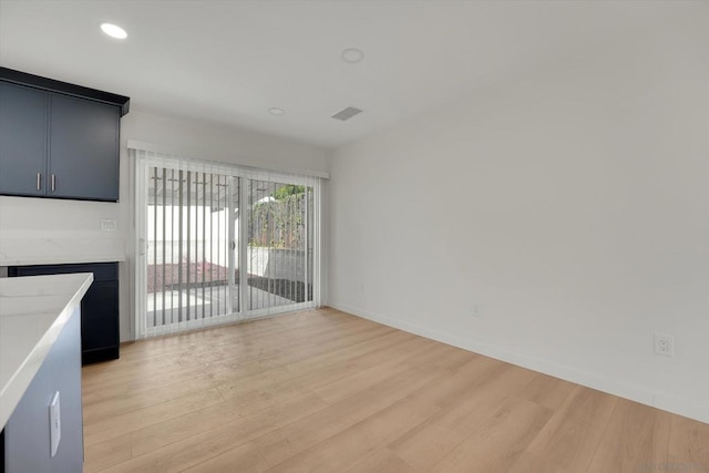 unfurnished living room with light hardwood / wood-style floors