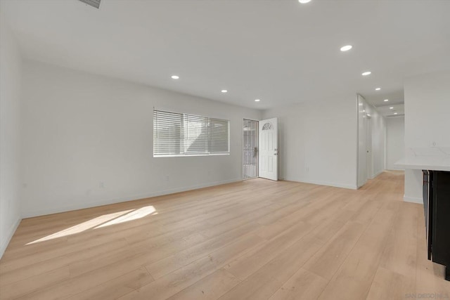 unfurnished living room with light hardwood / wood-style flooring