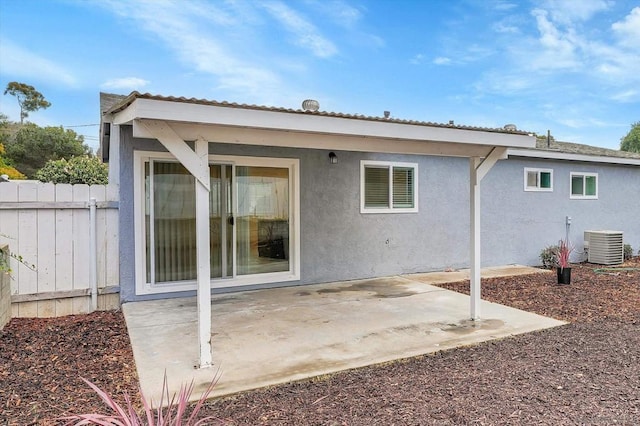 back of property featuring a patio and cooling unit