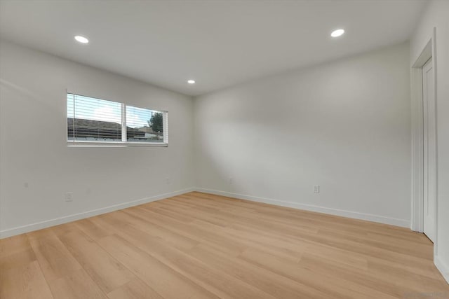 spare room featuring light wood-type flooring