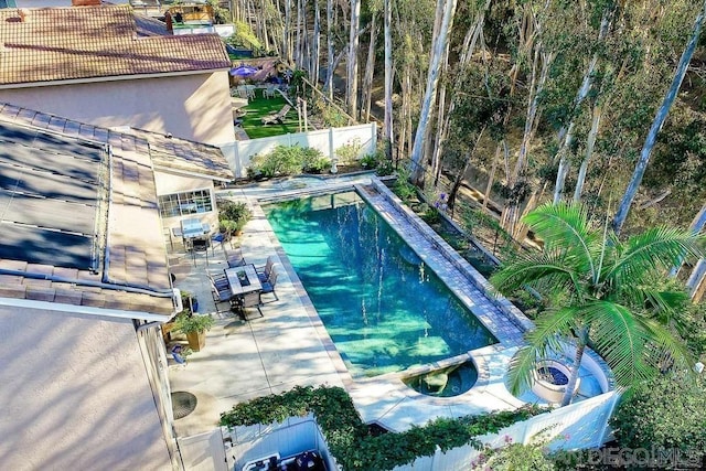 view of swimming pool featuring a patio area