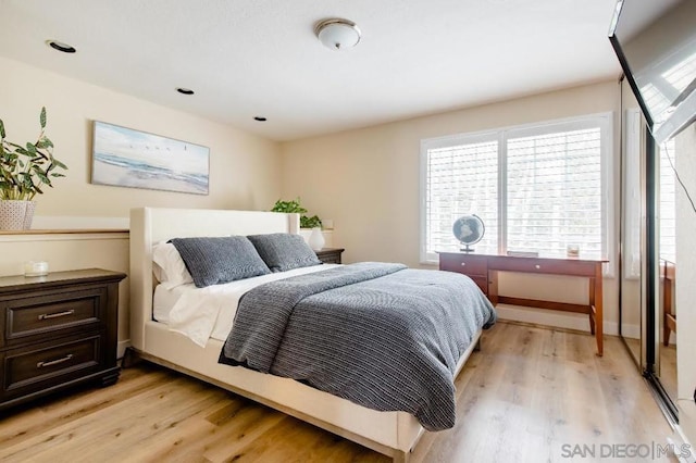 bedroom with light hardwood / wood-style floors