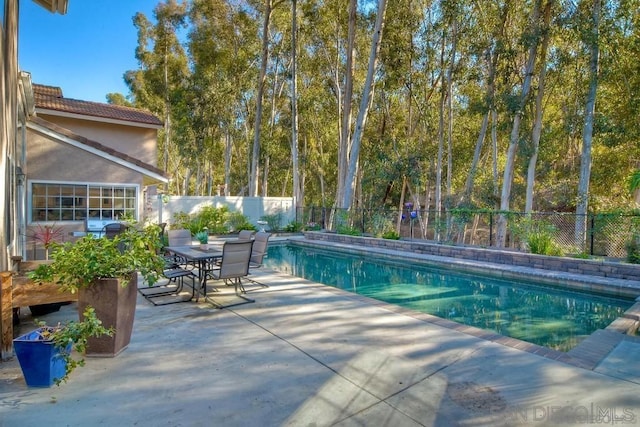 view of pool featuring a patio