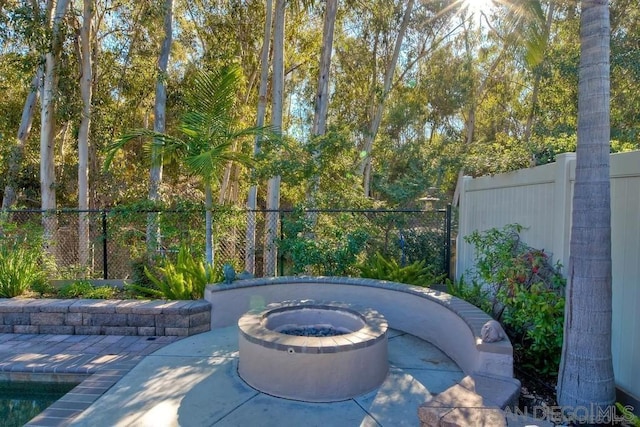 view of patio featuring an outdoor fire pit