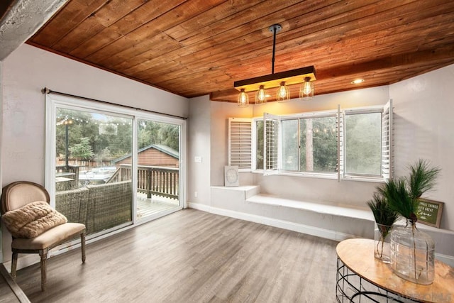 sitting room featuring wood-type flooring and wooden ceiling