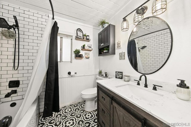 full bathroom with tile patterned flooring, vanity, shower / tub combo with curtain, and toilet