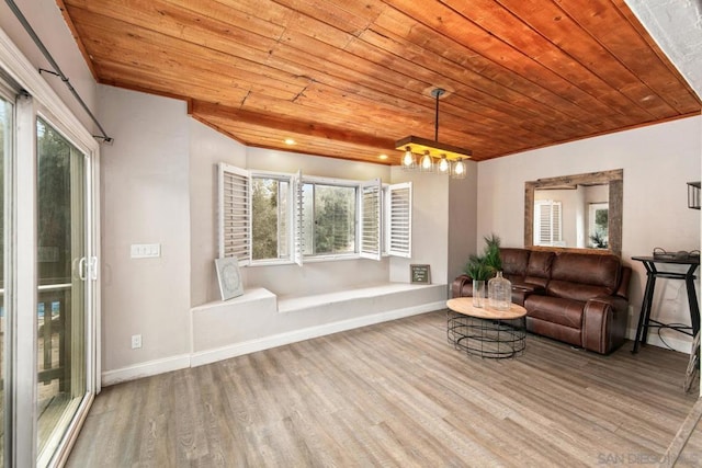 living room with an inviting chandelier, hardwood / wood-style flooring, and wooden ceiling