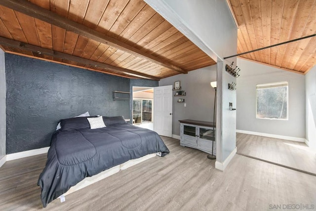 bedroom featuring beamed ceiling, hardwood / wood-style floors, and wooden ceiling