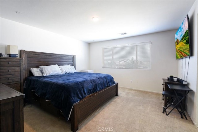 bedroom with light carpet