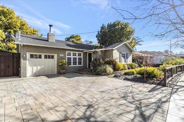 single story home featuring a garage