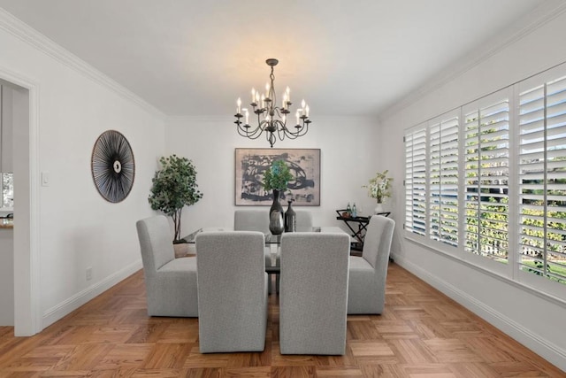 dining space featuring ornamental molding, light parquet flooring, and a notable chandelier