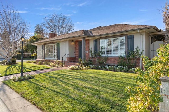 ranch-style house with a front lawn