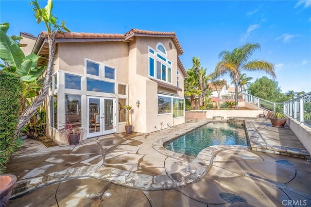 rear view of property with a patio and french doors