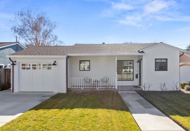 single story home featuring a porch, a garage, and a front yard