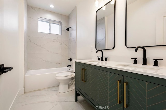 full bathroom with vanity, toilet, and tiled shower / bath