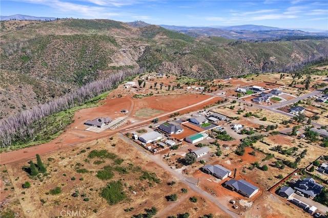 birds eye view of property featuring a mountain view