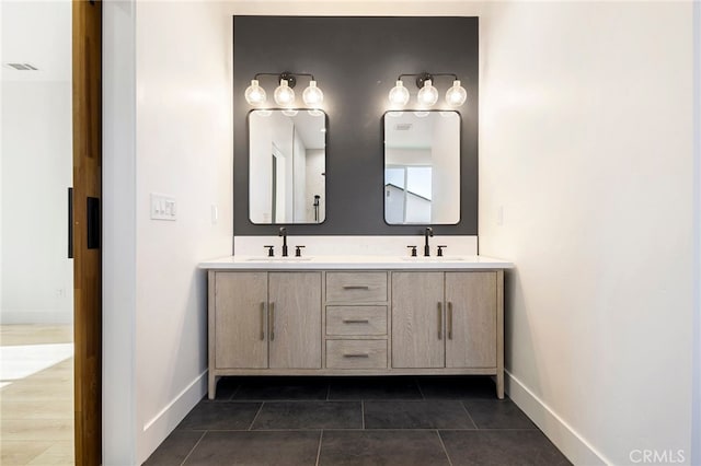 bathroom with vanity and tile patterned flooring