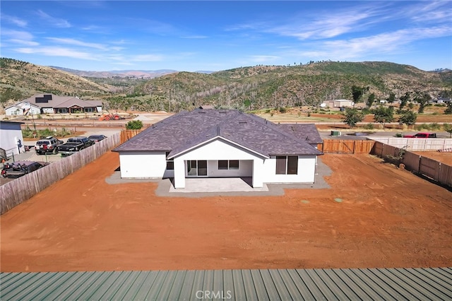 birds eye view of property with a mountain view