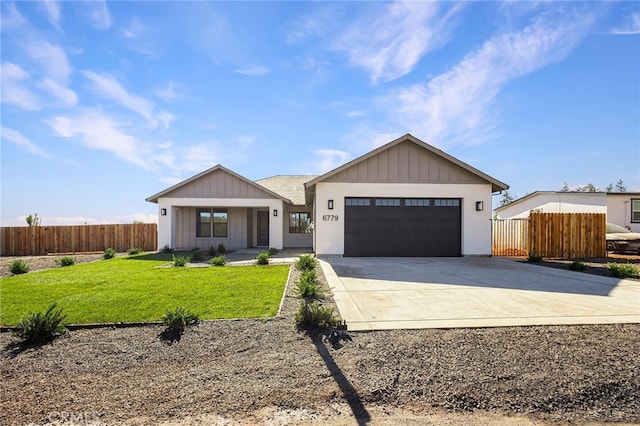 modern inspired farmhouse featuring a garage and a front lawn