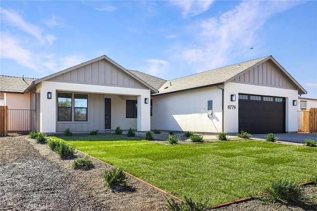 modern farmhouse featuring a garage and a front yard