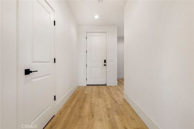 corridor with light wood-type flooring