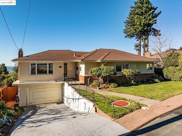 ranch-style house with a garage and a front lawn