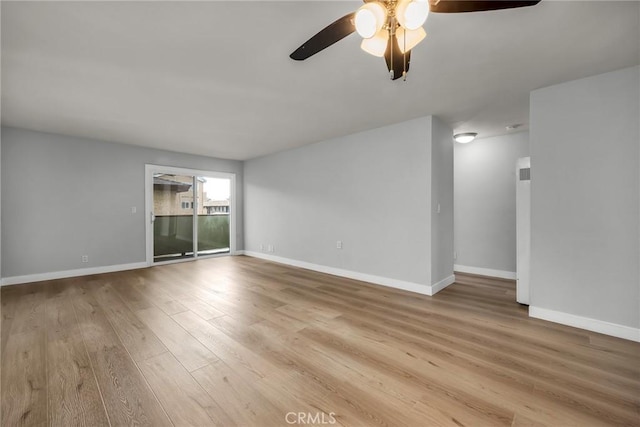 spare room with ceiling fan and light hardwood / wood-style floors