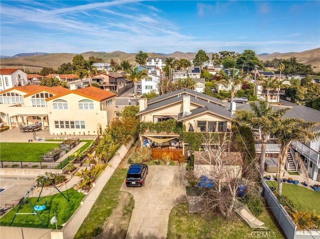 birds eye view of property featuring a mountain view