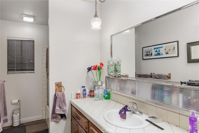 bathroom with vanity and hardwood / wood-style floors