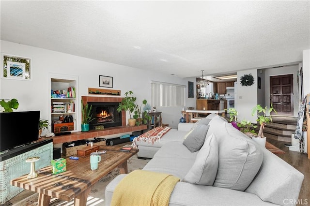 living room featuring hardwood / wood-style flooring and a textured ceiling