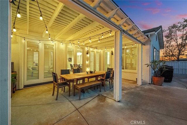 view of patio terrace at dusk