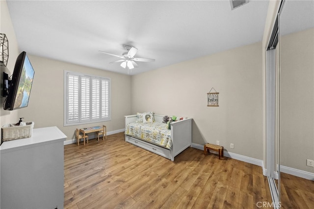 bedroom featuring light hardwood / wood-style flooring and ceiling fan