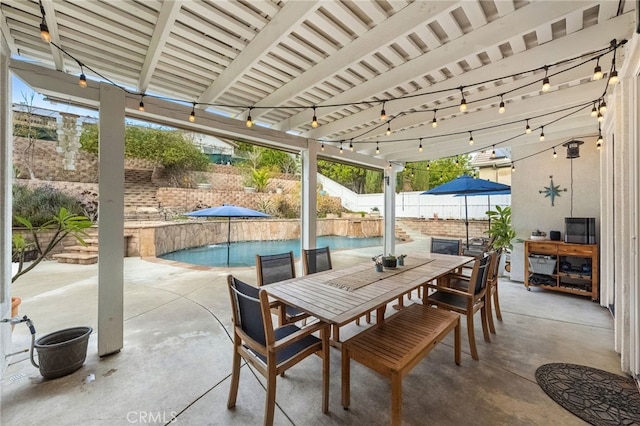 view of patio / terrace with a fenced in pool