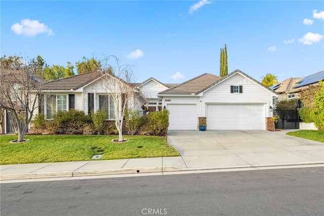 ranch-style house featuring a garage and a front lawn