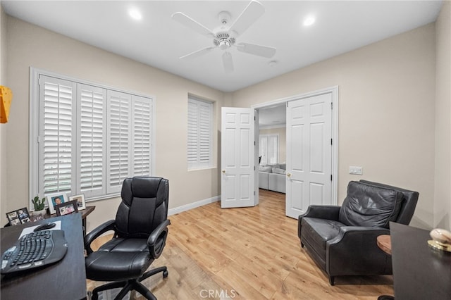 home office featuring ceiling fan and light wood-type flooring