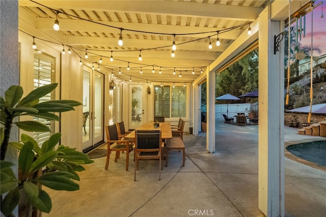 view of patio terrace at dusk