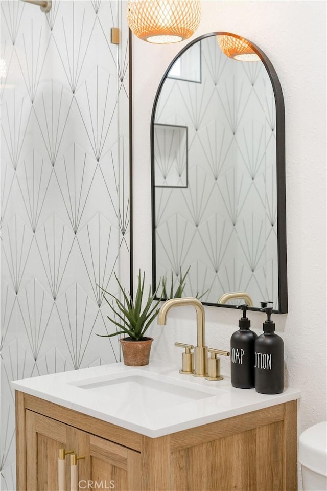 bathroom with vanity and toilet