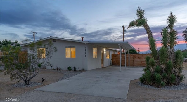 view of front of property featuring a carport