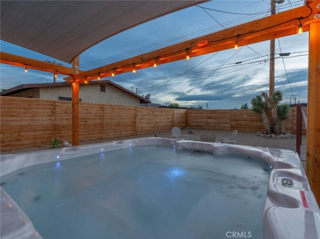 view of pool with a hot tub