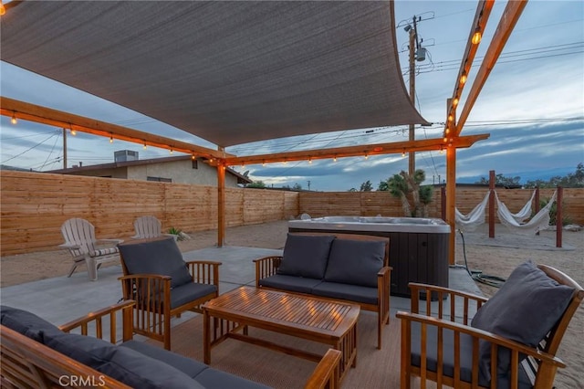 view of patio / terrace featuring an outdoor living space and a hot tub