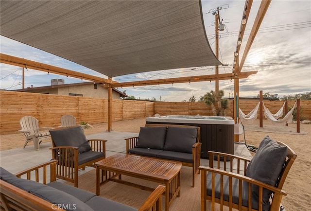 view of patio with a hot tub and outdoor lounge area