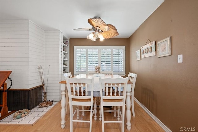 dining space featuring ceiling fan and light hardwood / wood-style flooring