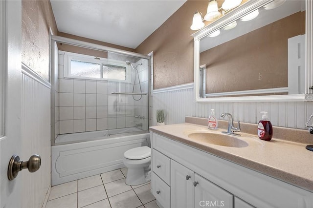 full bathroom with toilet, tile patterned floors, shower / bath combination with glass door, and vanity