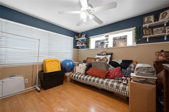 bedroom featuring ceiling fan and light hardwood / wood-style floors