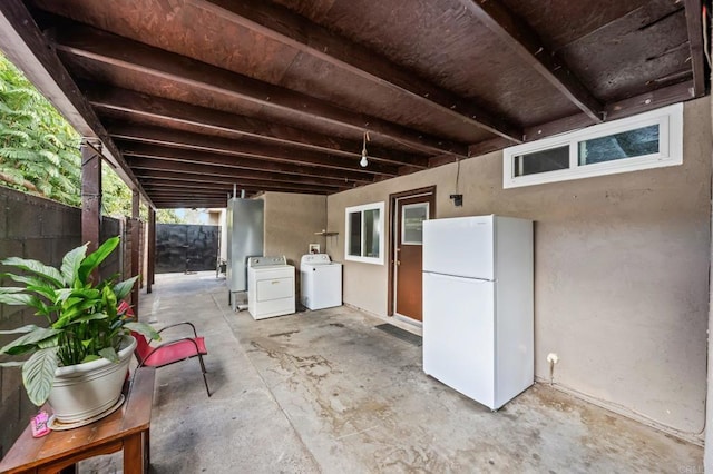 view of patio / terrace featuring washing machine and clothes dryer